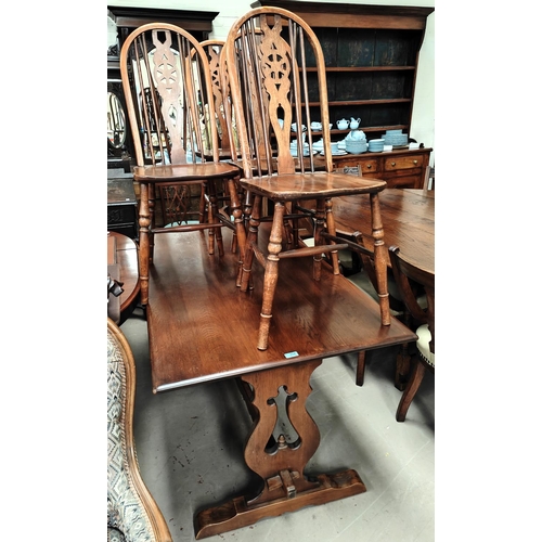 933 - An Old Charm oak refectory dining table with 4 wheel back dining chairs, table 153 x 81cm