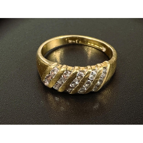 678 - An 18 carat hallmarked gold ring set 5 rows of 3 small diamonds in vertical design, 3.9gm, size K