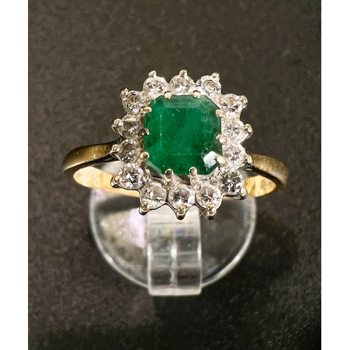 683 - An 18 carat hallmarked gold dress ring set square cushion cut emerald surrounded by 14 diamonds, gro... 