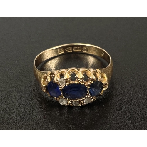 685 - An 18 carat hallmarked gold dress ring with 3 sapphires and diamond chips in split shank setting (2 ... 