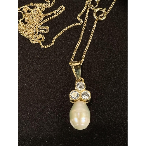 690 - An 18 carat hallmarked gold pendant set 3 diamonds with pearl drop, on fine chain stamped '9K'