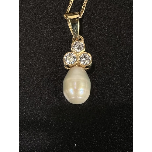 690 - An 18 carat hallmarked gold pendant set 3 diamonds with pearl drop, on fine chain stamped '9K'