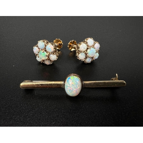 691 - A pair of screw earrings set opal coloured stones as a flowerhead, stamped '375', 3.2gm; a bar brooc... 