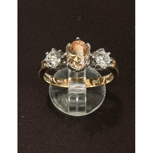 692 - A 9 carat hallmarked gold ring set central brown stone and 2 clear stones, 3.4gm, size P