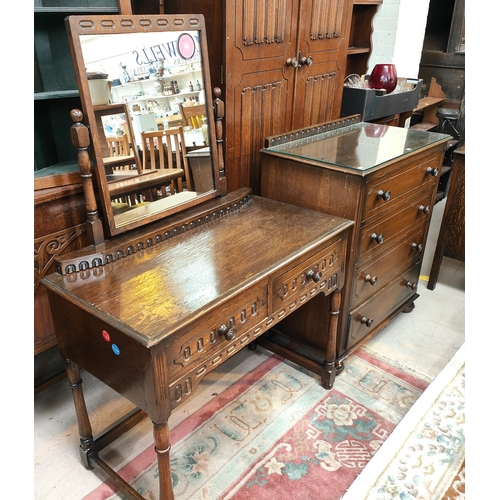 846 - A Jacobean style carved oak bedroom suite of 4 pieces comprising double door wardrobe, 4 height ches... 