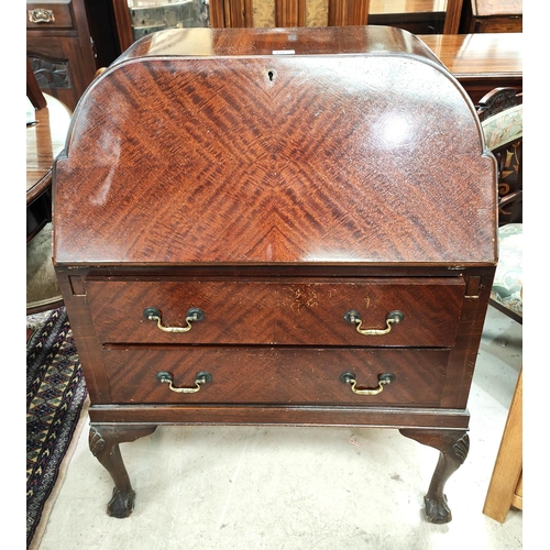 918 - A 1930's mahogany bureau with fitted interior, two shelves below on ball and claw feet; a mahogany c... 