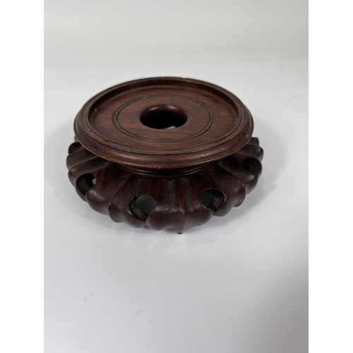 402 - A Chinese oxblood glazed bottle vase, with seal mark to base, hard wood stand, height 32cm