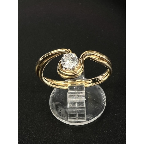 673 - An 18 carat hallmarked gold solitaire ring in drop setting, the diamond 3mm approx, 2.7gm gross weig... 