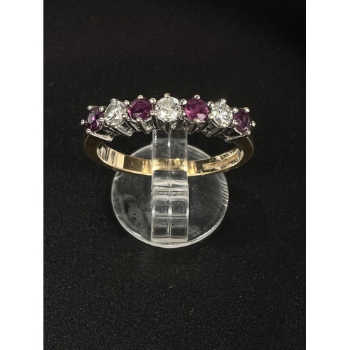 686 - An 18 carat hallmarked gold dress ring with 3 diamonds and 4 rubies in alternating setting, gross we... 