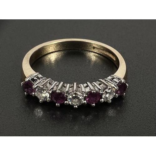 686 - An 18 carat hallmarked gold dress ring with 3 diamonds and 4 rubies in alternating setting, gross we... 