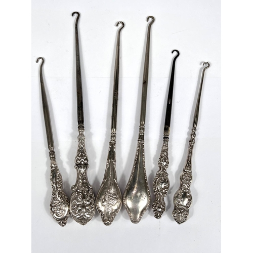 760 - Six various hall marked silver handled button hooks with different designs, dates and assay offices