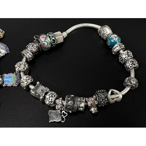 765 - A Pandora style bracelet with various charms (20) by Chamilia; a hallmarked sterling silver charm br... 