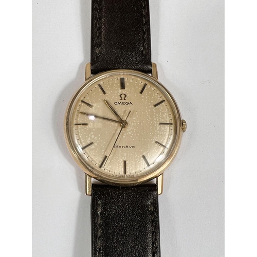 771 - A gents circa 1960s 9ct gold backed Omega geneve swiss made mechanical wristwatch with later strap b... 