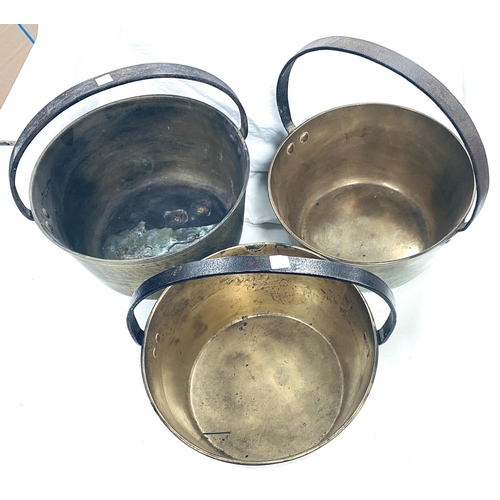 100 - Three large brass jam pans diameters 33cm, 30cm and 29cm