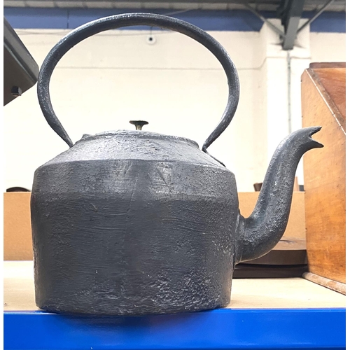 102 - A cast iron camp kettle