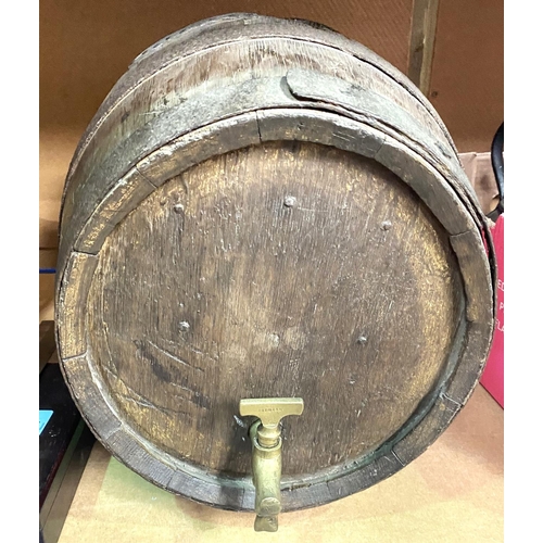 105 - A wooden barrel with metal bindings and a brass tap, length 42cm