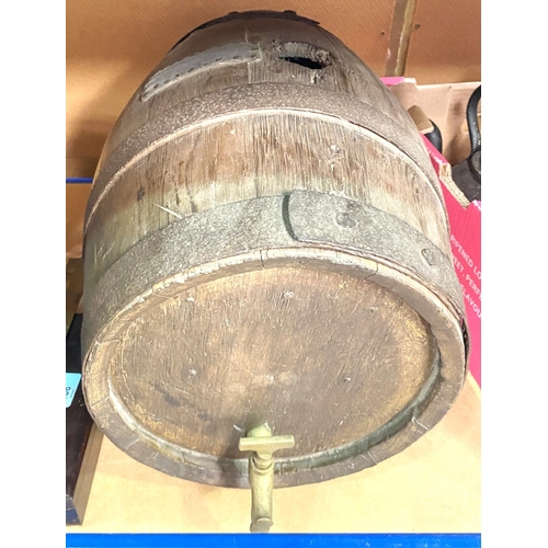 105 - A wooden barrel with metal bindings and a brass tap, length 42cm