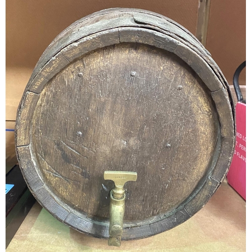 105 - A wooden barrel with metal bindings and a brass tap, length 42cm