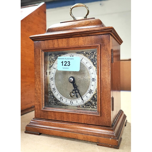 123 - A small Georgian style walnut cased bracket clock