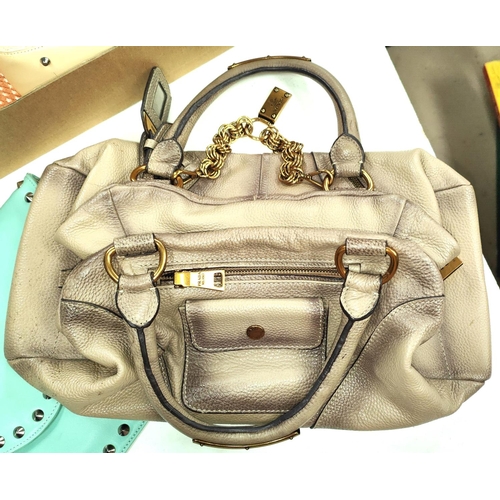 149 - Three handbags:- a beige grey bag with gilt chain, gilt zip tags and lock stamped Prada, rope/Prada ... 