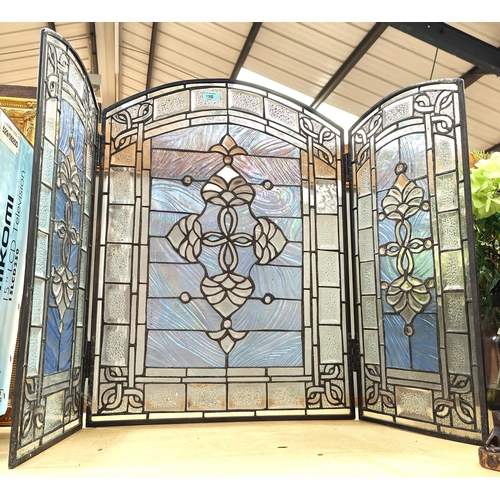 196 - An early 20th century firescreen of 3 coloured and leaded glass panels