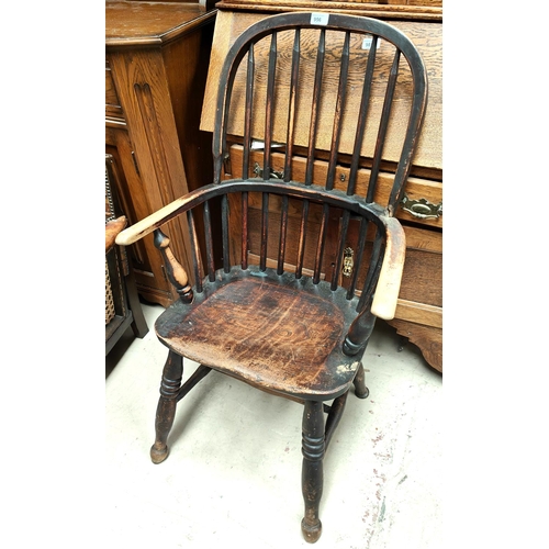 956 - A stick back Windsor armchair with turned legs and a wheel back armchair