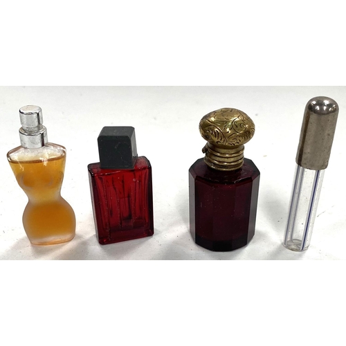 57 - A Victorian ruby glass scent bottle, 5cm; another; 2 miniature perfumes