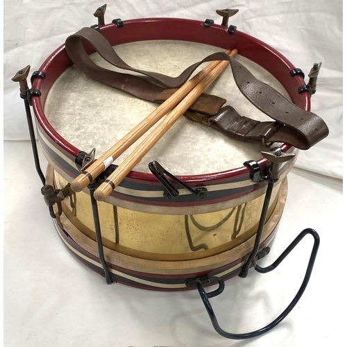 63 - A 20th century marching drum in brass, steel and painted wood, diameter 37cm; a Boys Brigade belt