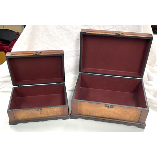 67 - A walnut veneered cigar box; a matching box