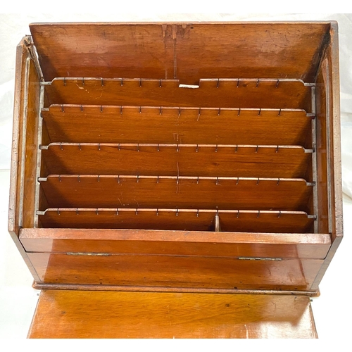 70 - An Edwardian fitted correspondence box with slope front; an Art Deco bakelite bookshelf; etc.