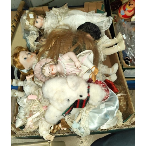 211 - A china piano baby; a selection of Victorian style china head dolls