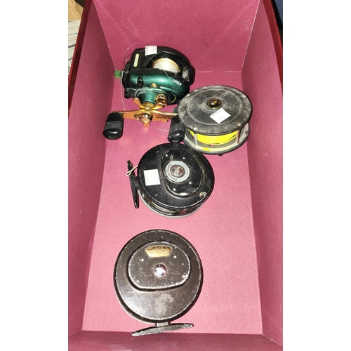 241 - Three fly fishing reels and a spinning reel