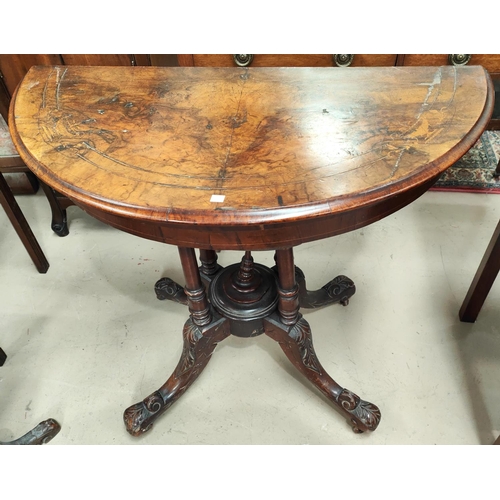 837 - A Victorian figured walnut card table the demi-lune fold over top with marquetry inlaid decoration, ... 