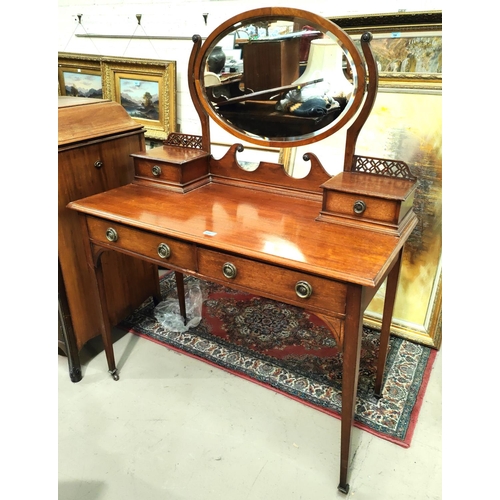 853 - An Arts & Crafts period kneehole mahogany dressing table with 2 drawers and 2 jewellery drawers ... 