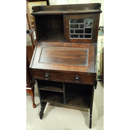 868 - A Liberty's small oak bureau with open shelves and mullion glazed cupboard, folding side shelf, and ... 