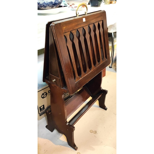 933A - A mahogany periodical and book stand with drawers and pipe rack