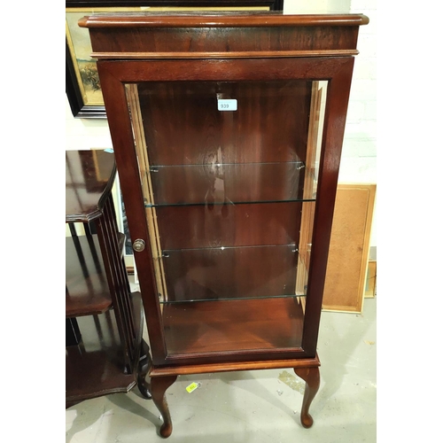 939 - A narrow mahaogany china cabinet enclosed by single door; a glazed bow front corner display unit