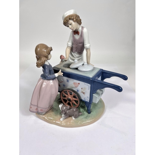 616 - A Lladro group of ice cream vendor serving young girl, number 5325, height 23cm          WITHDRAWN... 