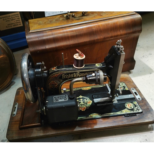 142 - A vintage Frister & Rossman Sewing Machine in inlaid walnut case