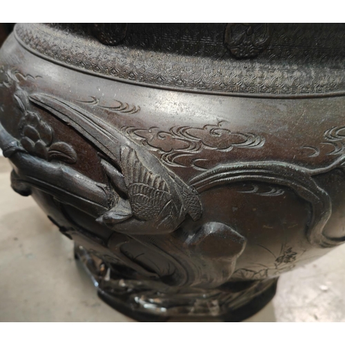 399 - A large Japanese Meiji period bronze jardinière with relief decoration of birds on branches and seal... 