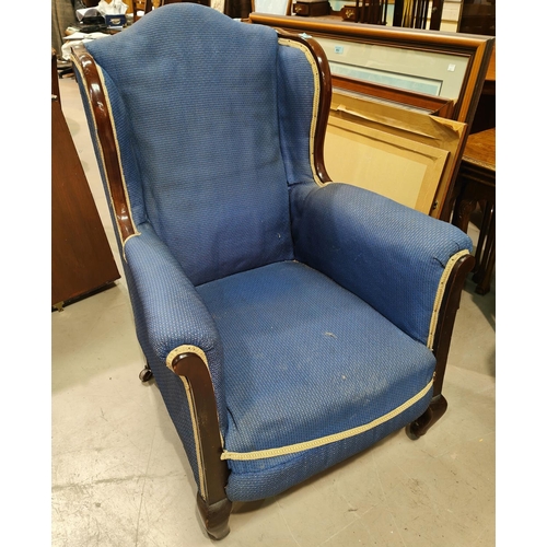 919 - An Ewardian high back armchair with mahogany frame, light blue upholstery