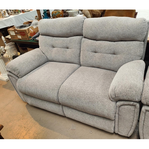 944 - A modern 2 seater settee in grey fabric