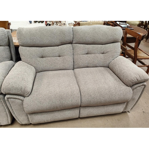 944A - A modern 2 seater settee in grey fabric