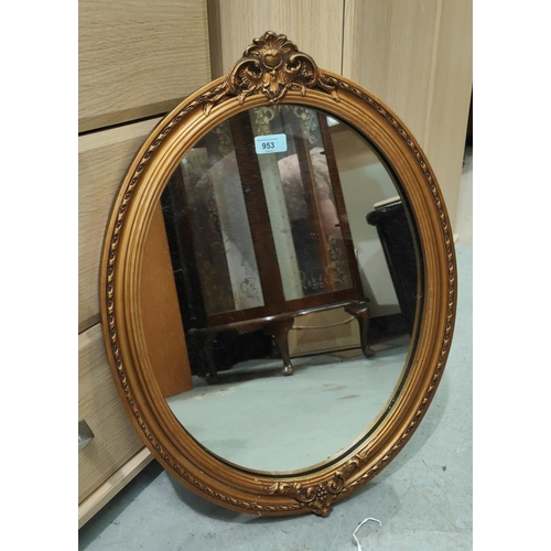 953 - An oval gilt framed wall mirror, height 63cm