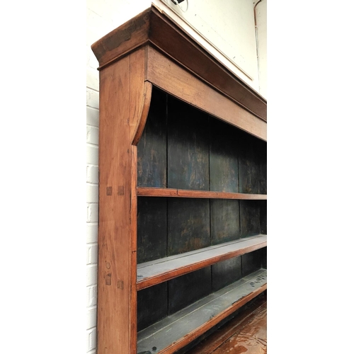 989 - An large 18th century oak country made Welsh dresser with four central drawers, two cupboards with d... 