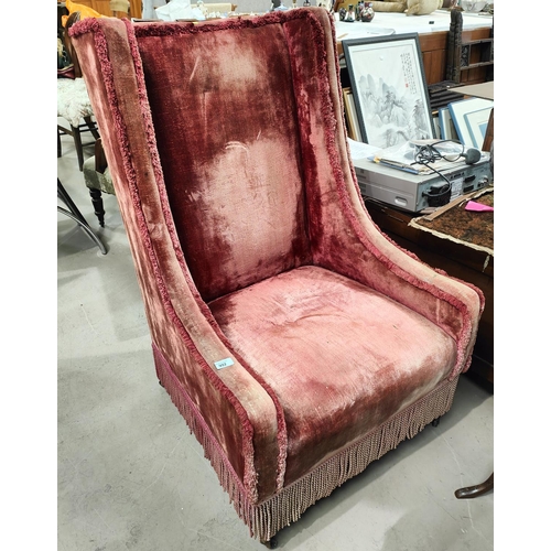 992 - An early 20th century high back armchair in red plush fabric