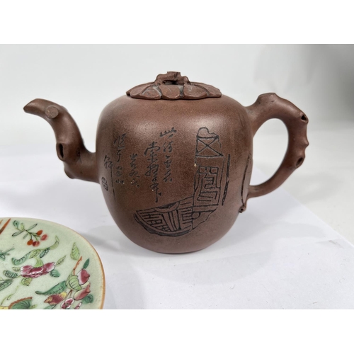 395 - A Chinese Yi-Xing teapot with incised blossom decoration and naturalistic handle and spout and lid a... 