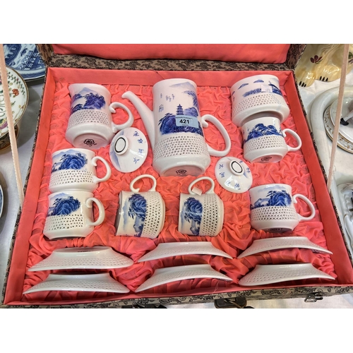 421 - A 20th century Chinese blue & white coffee set with reticulated lower sections, in presentation ... 