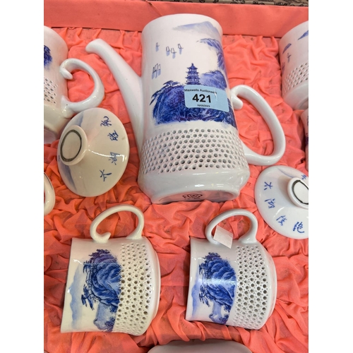 421 - A 20th century Chinese blue & white coffee set with reticulated lower sections, in presentation ... 