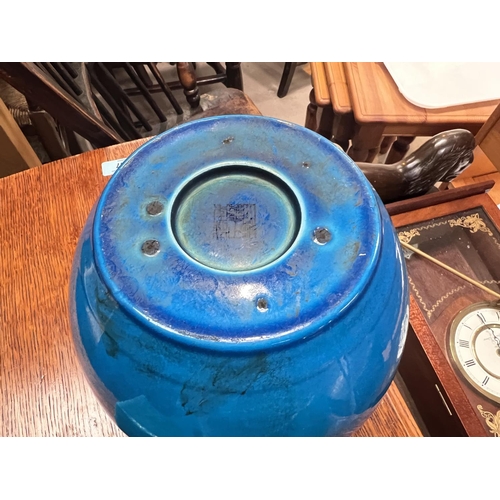 447 - A Chinese blue glaze double handled pot, the handles being faces, seal mark to base, height 18cm, tw... 